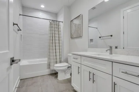a view of a hallway with couch and the front door