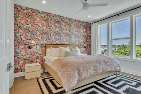 a bedroom with a bed and hallway