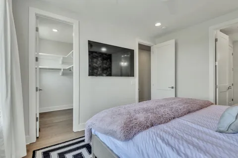 a bathroom with a double vanity sink a toilet and a mirror
