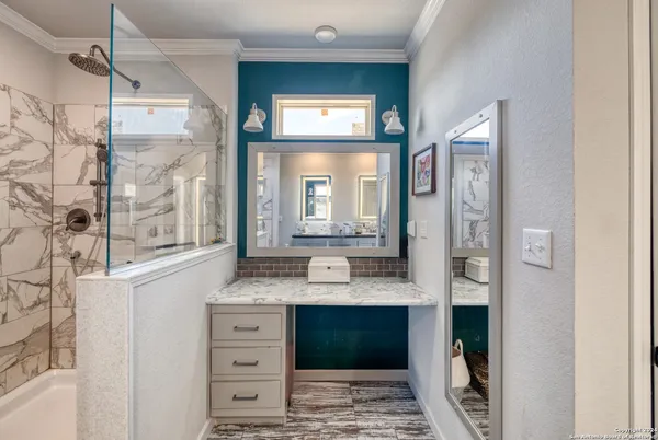 a bathroom with a double vanity sink and a mirror