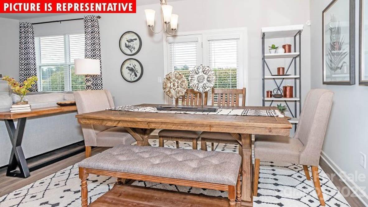2167 Vanderlyn Street Monroe, NC 28112 - Photo 12 of 22 a view of a table and chairs in a room