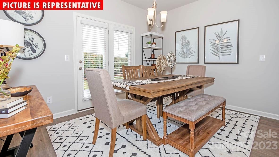 2167 Vanderlyn Street Monroe, NC 28112 - Photo 13 of 22 a view of a dining room with furniture window and wooden floor