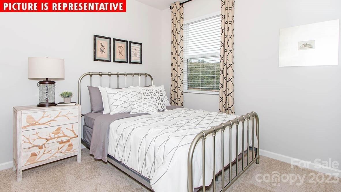 2167 Vanderlyn Street Monroe, NC 28112 - Photo 14 of 22 a bedroom with a bed and a window