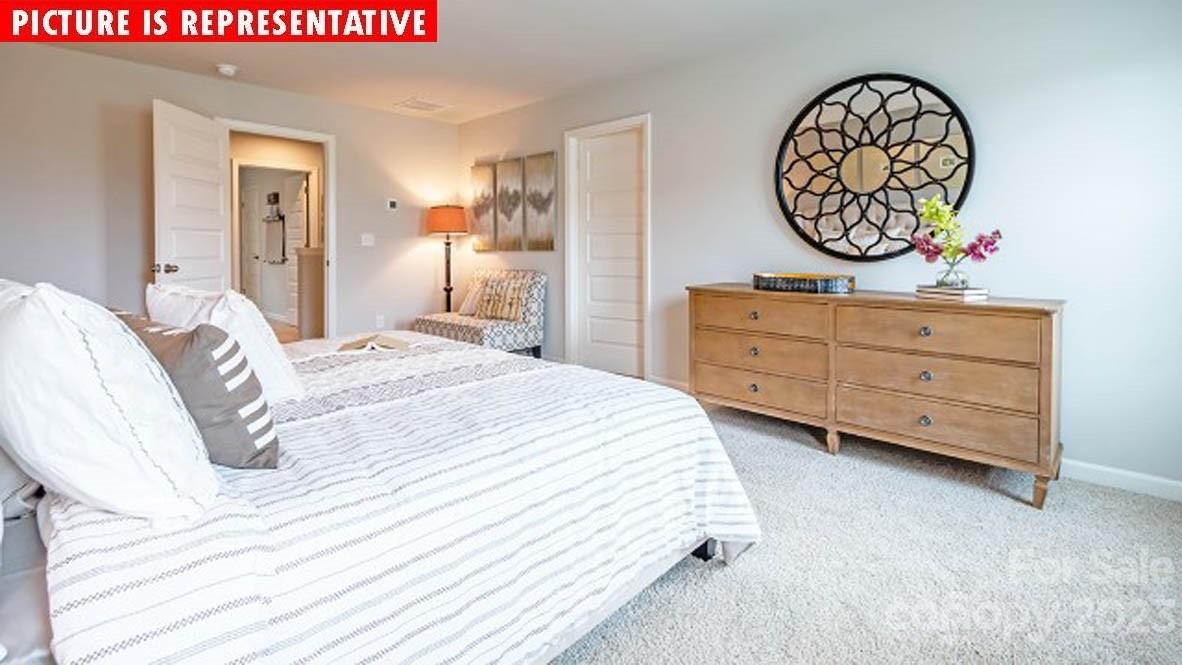 2167 Vanderlyn Street Monroe, NC 28112 - Photo 20 of 22 a bedroom with a bed and a dresser