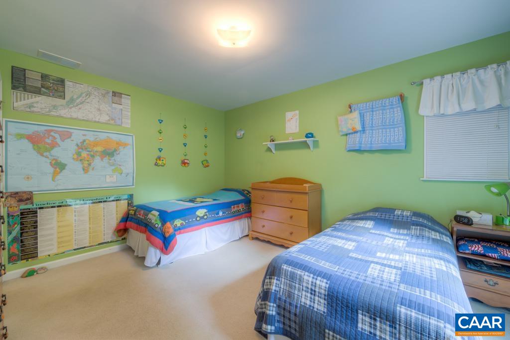 95 Rudolph Street Ruckersville, VA 22968 - Photo 22 of 34 a bedroom with two beds and paintings on the wall