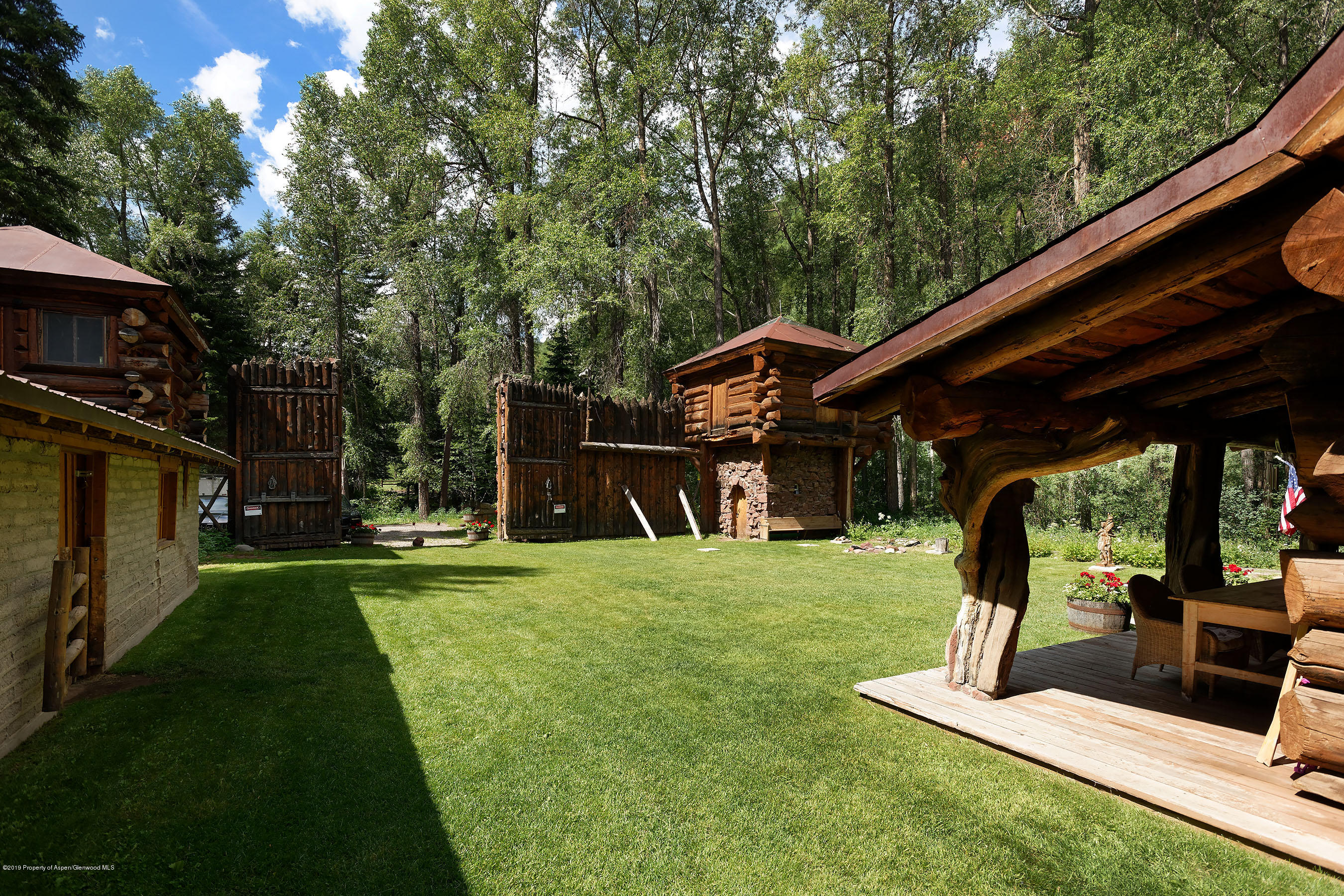 245-289 Conundrum Creek Road Aspen, CO 81611 - Photo 11 of 28 a view of a backyard with sitting area