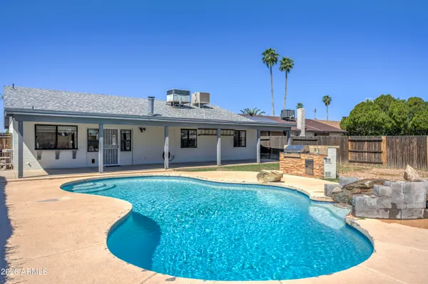 a view of a house with swimming pool