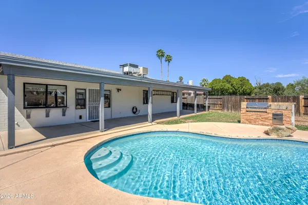 a view of a house with swimming pool