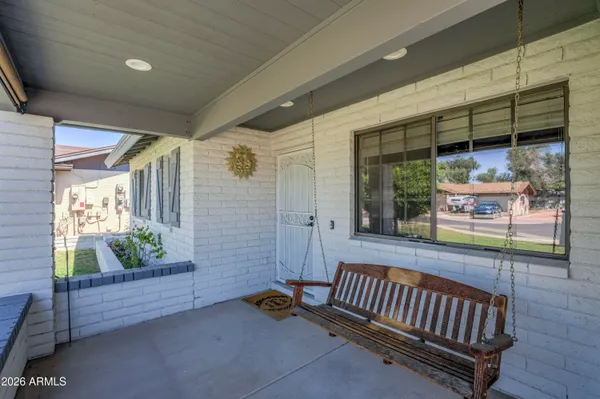 a view of two chairs in the balcony