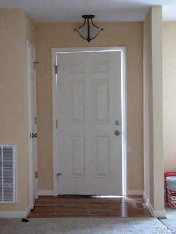 FOYER HAS TRUE HARDWOOD ENTRANCE AND COAT CLOSET.