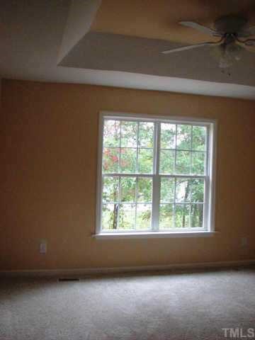 MASTER SUITE OFFER UPGRADED TRAY CEILING AND BEAUTIFUL VIEW OF WOODED BACK YARD.
