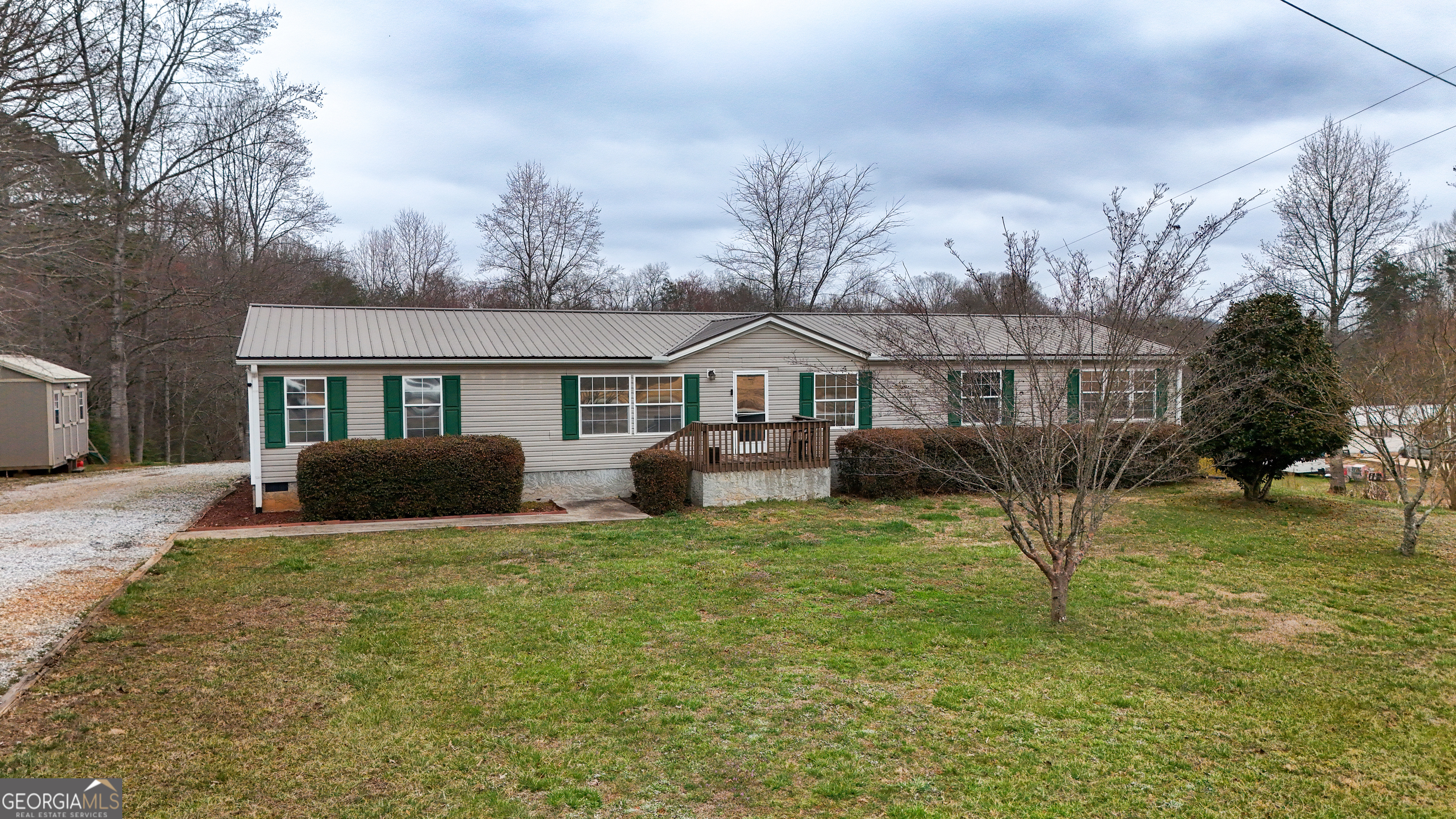 551 Hester Road Dahlonega, GA 30533 - Photo 1 of 35 a view of a house with a yard and porch