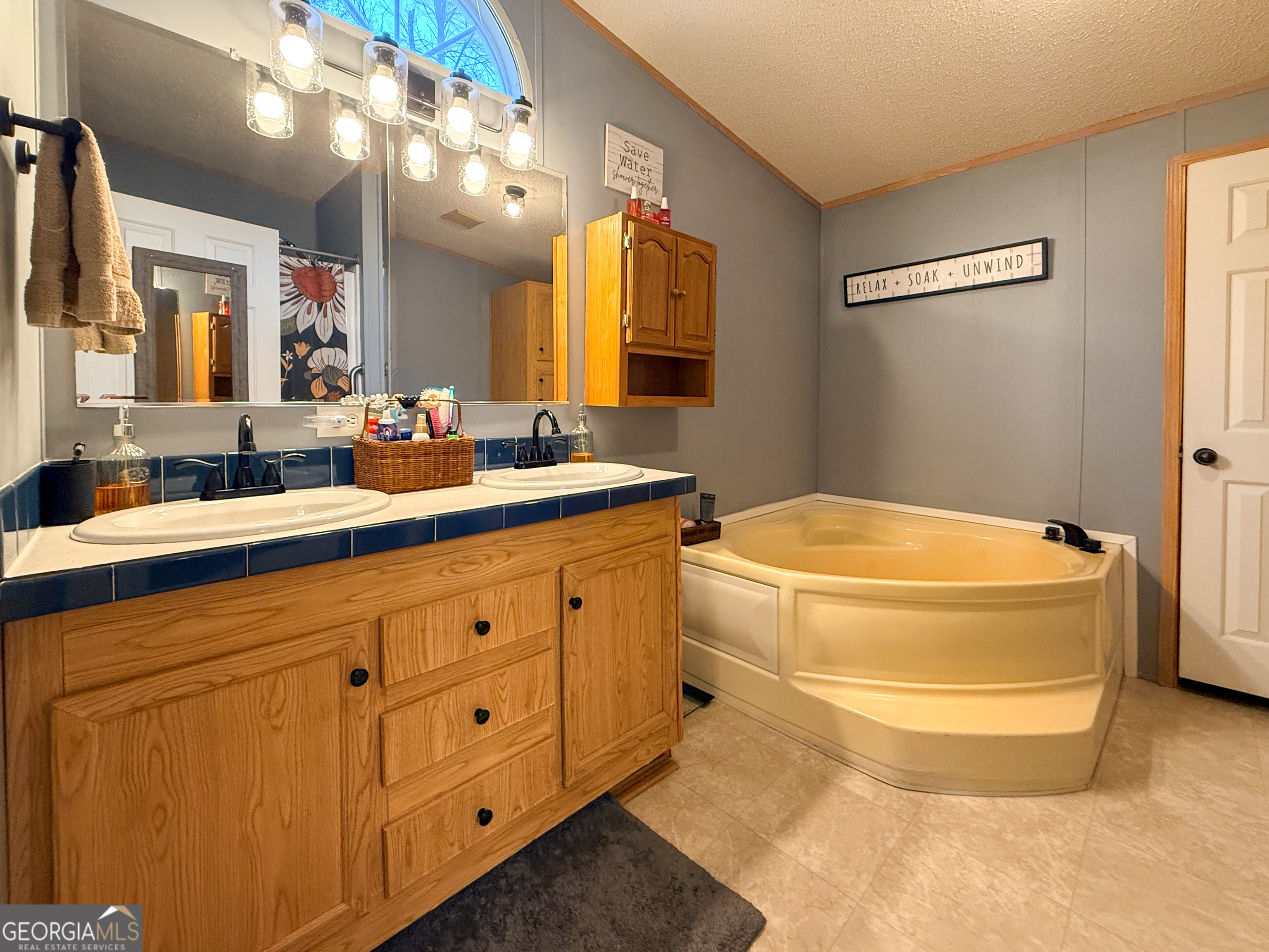 551 Hester Road Dahlonega, GA 30533 - Photo 15 of 35 a bathroom with a sink and a mirror