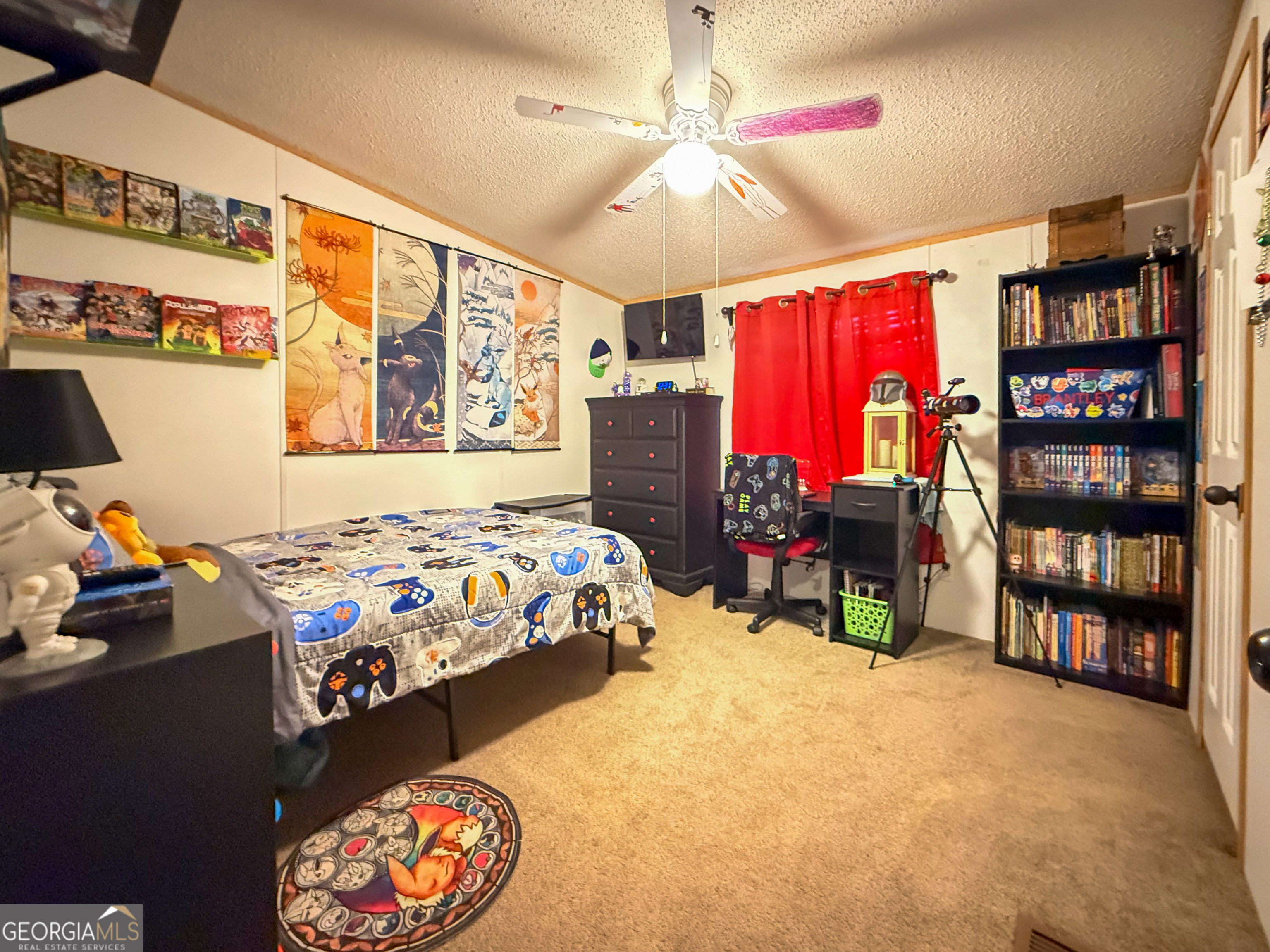 551 Hester Road Dahlonega, GA 30533 - Photo 19 of 35 a bedroom with a bed and a bookshelf