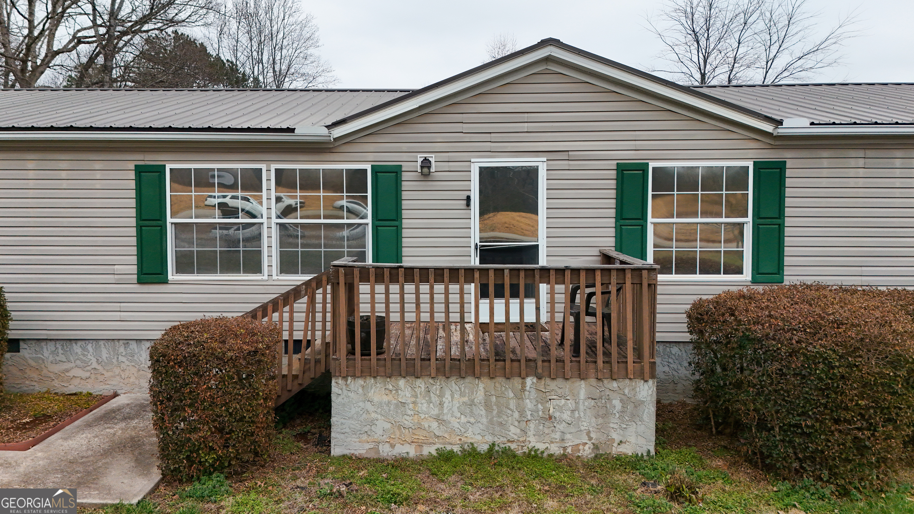 551 Hester Road Dahlonega, GA 30533 - Photo 2 of 35 a view of a house with a deck and furniture
