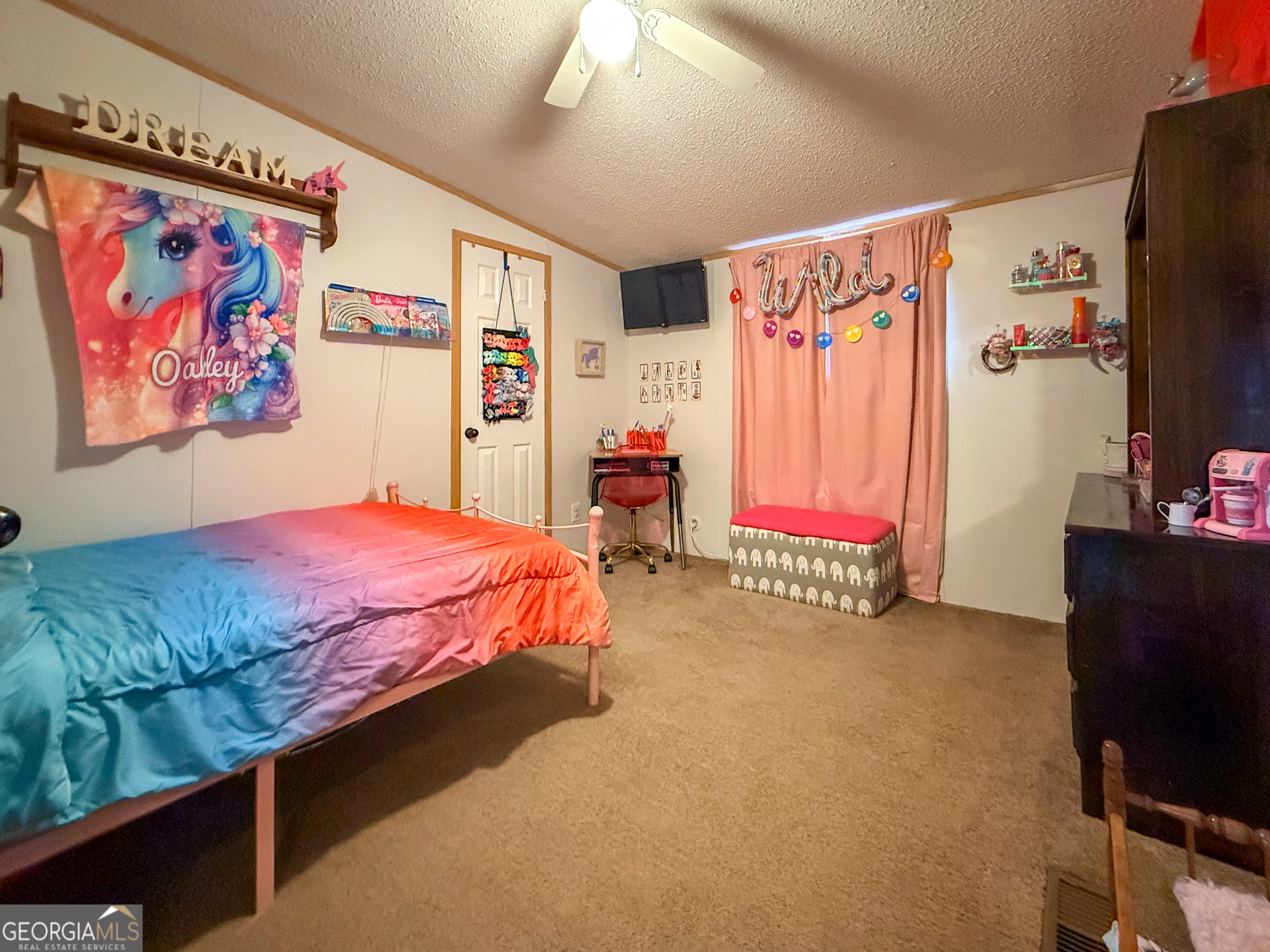 551 Hester Road Dahlonega, GA 30533 - Photo 21 of 35 a bedroom with a bed and a couch