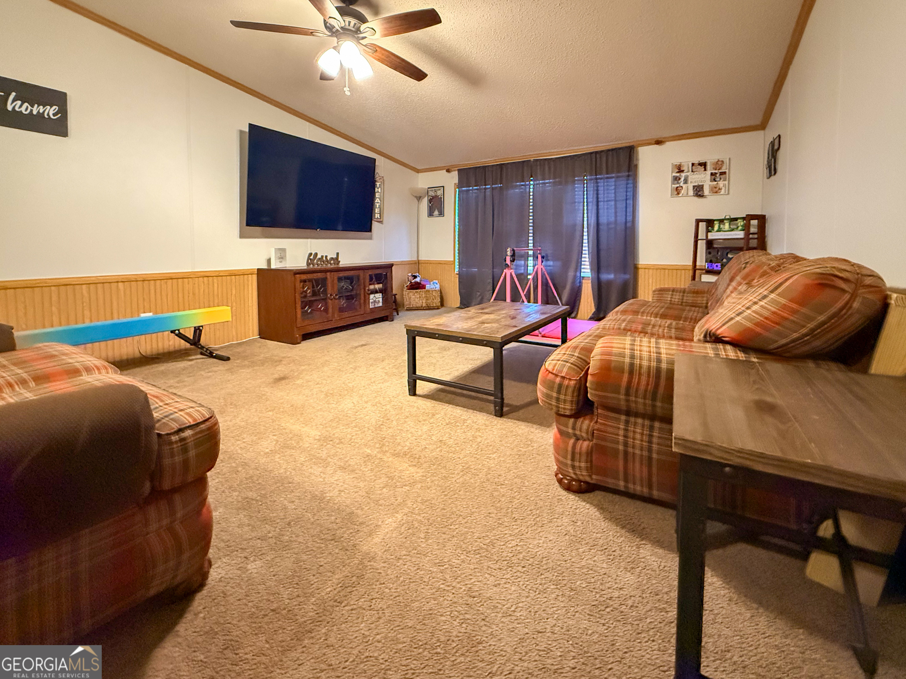 551 Hester Road Dahlonega, GA 30533 - Photo 26 of 35 a bedroom with furniture and a flat screen tv