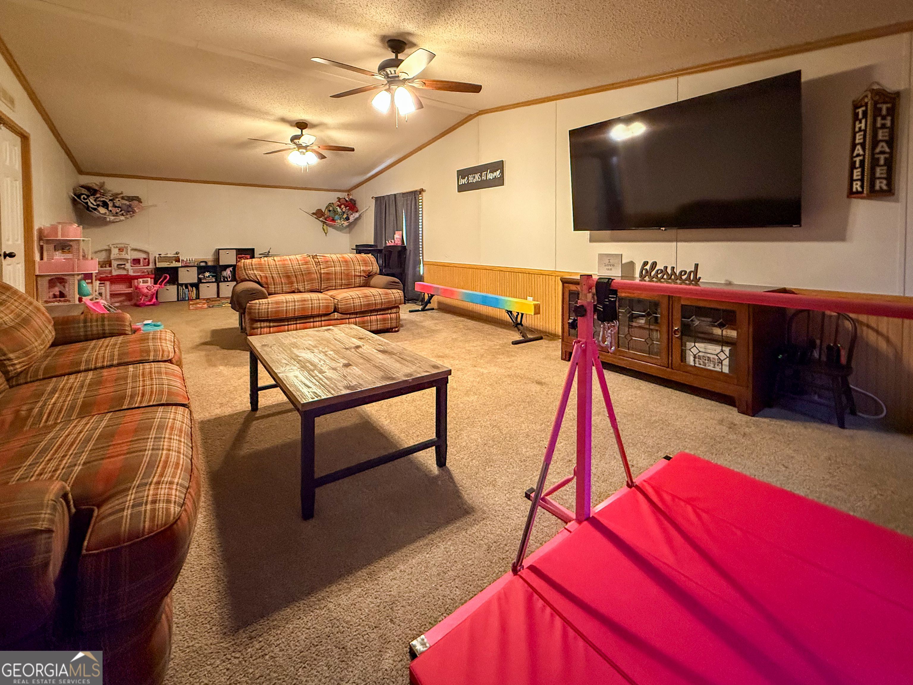 551 Hester Road Dahlonega, GA 30533 - Photo 27 of 35 a living room with furniture and a flat screen tv