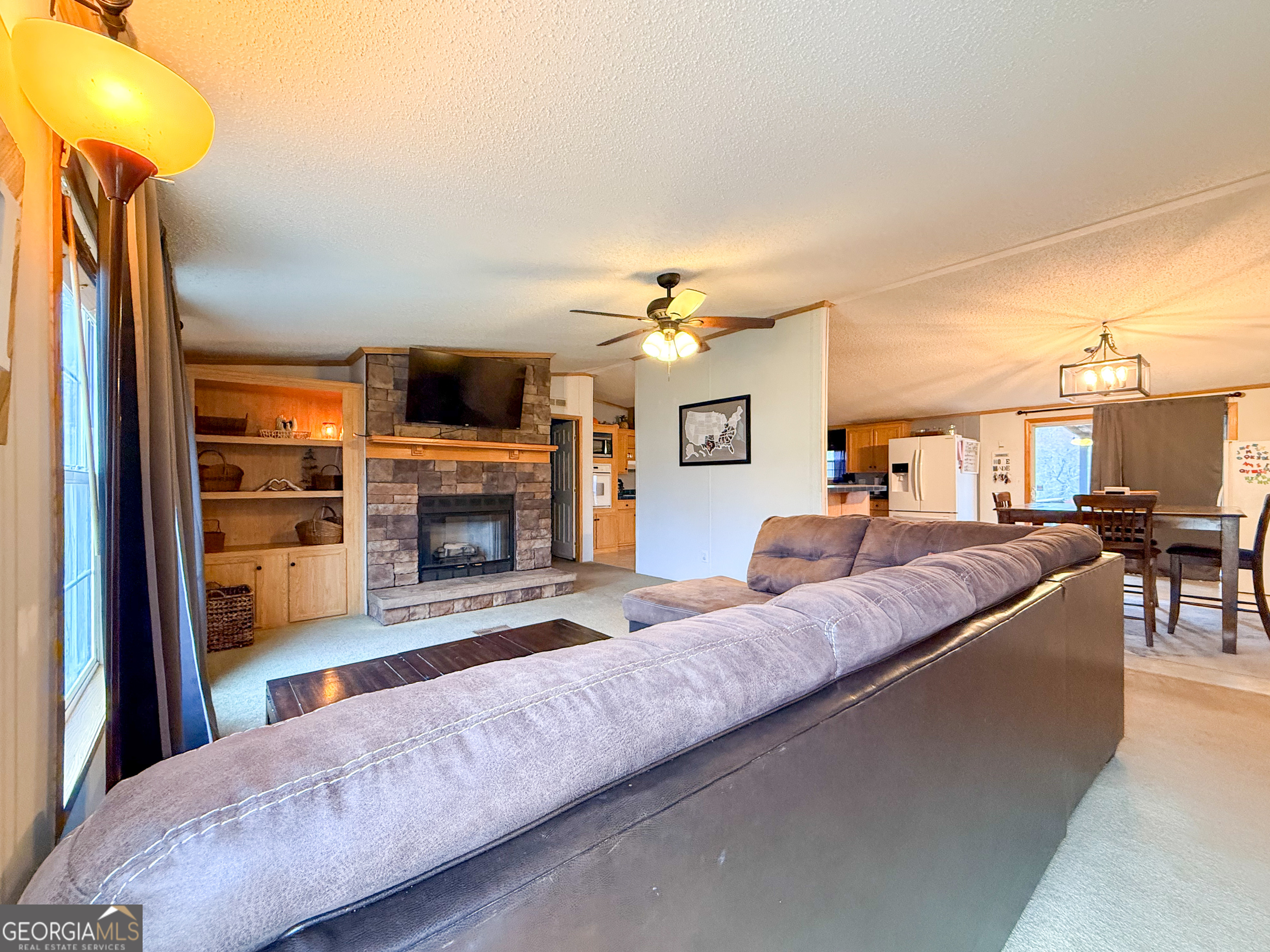 551 Hester Road Dahlonega, GA 30533 - Photo 3 of 35 a living room with furniture and a fireplace