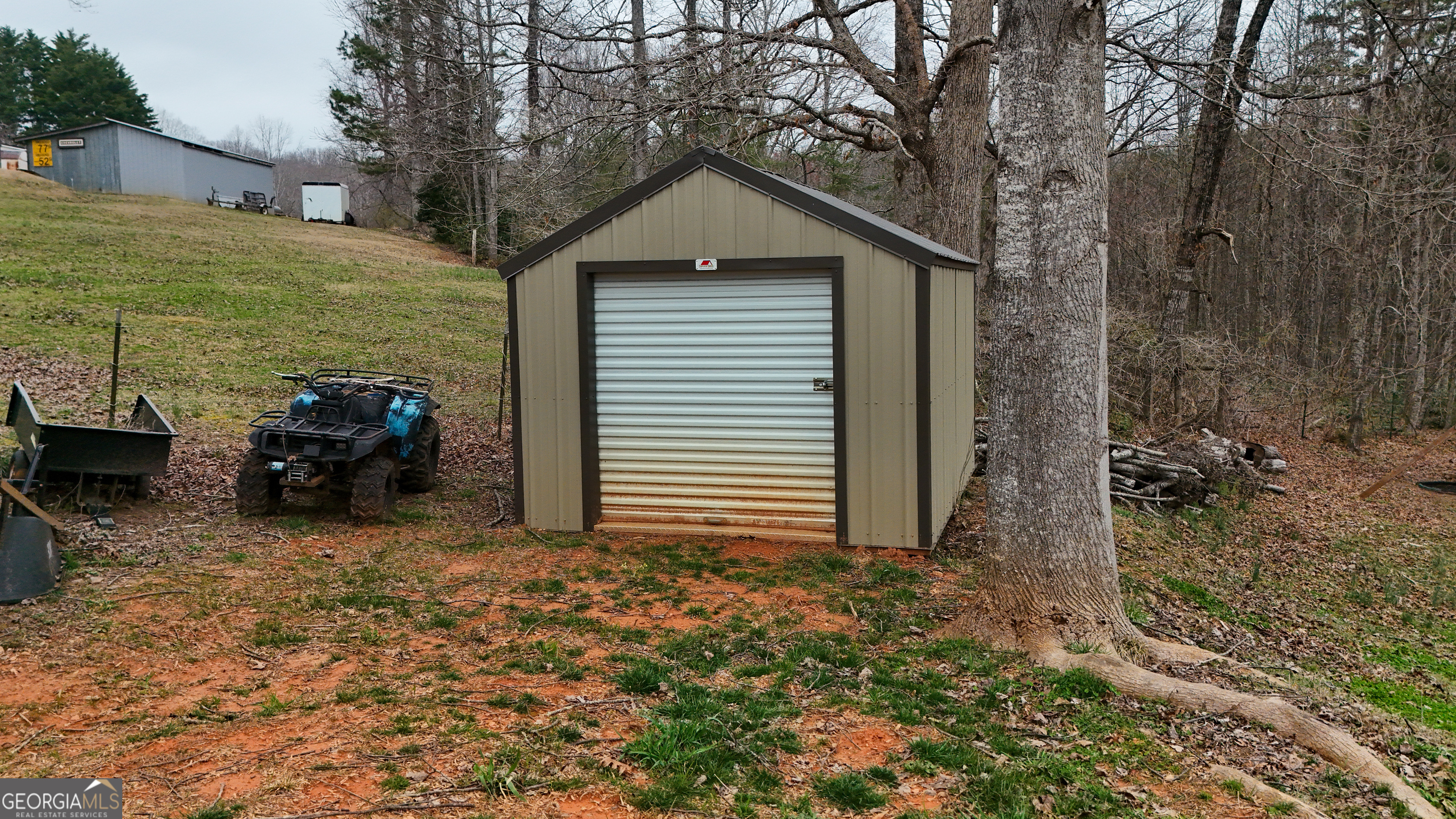 551 Hester Road Dahlonega, GA 30533 - Photo 32 of 35 a house with trees in the background