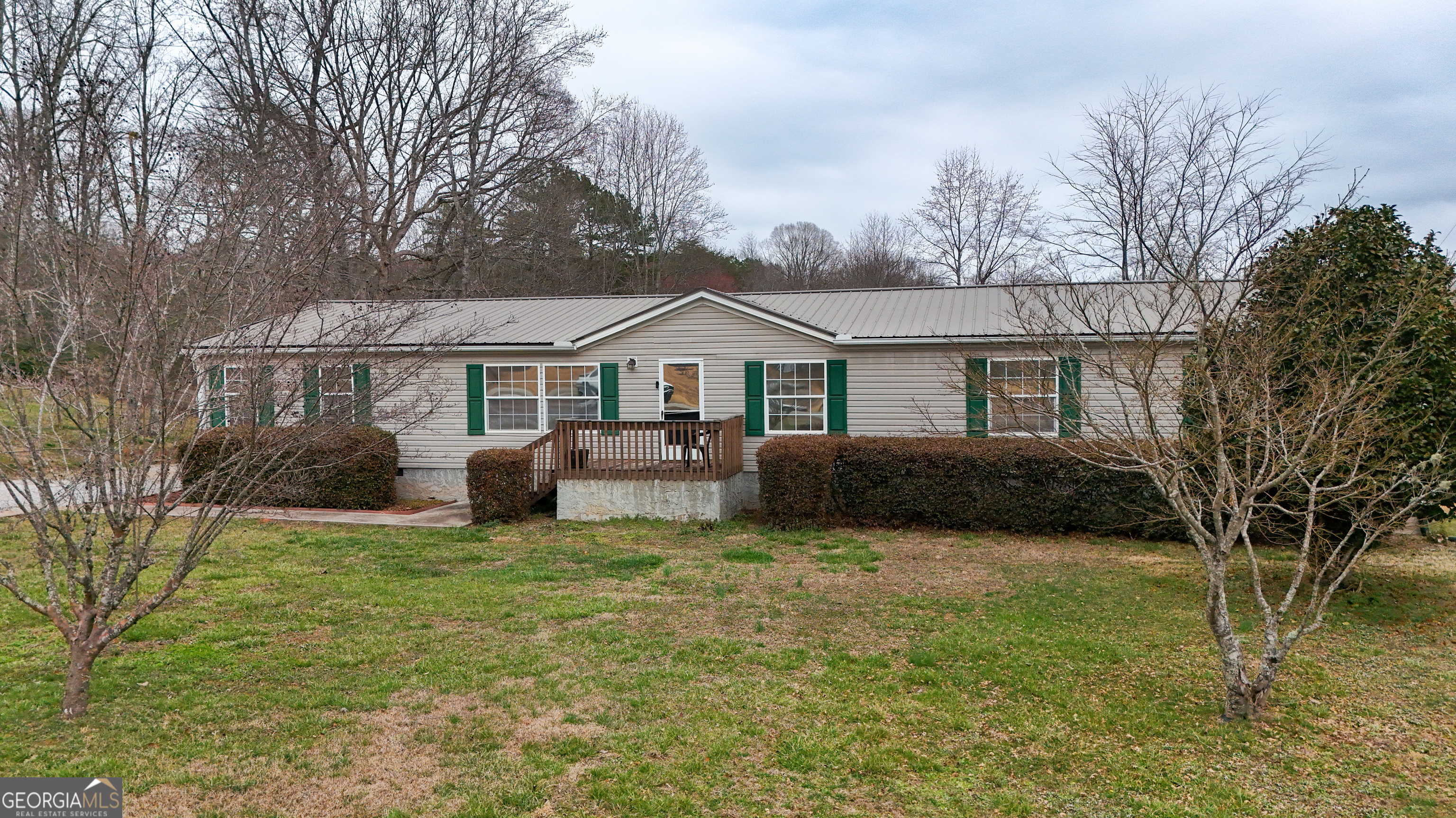 551 Hester Road Dahlonega, GA 30533 - Photo 35 of 35 a view of a house with a big yard and large trees