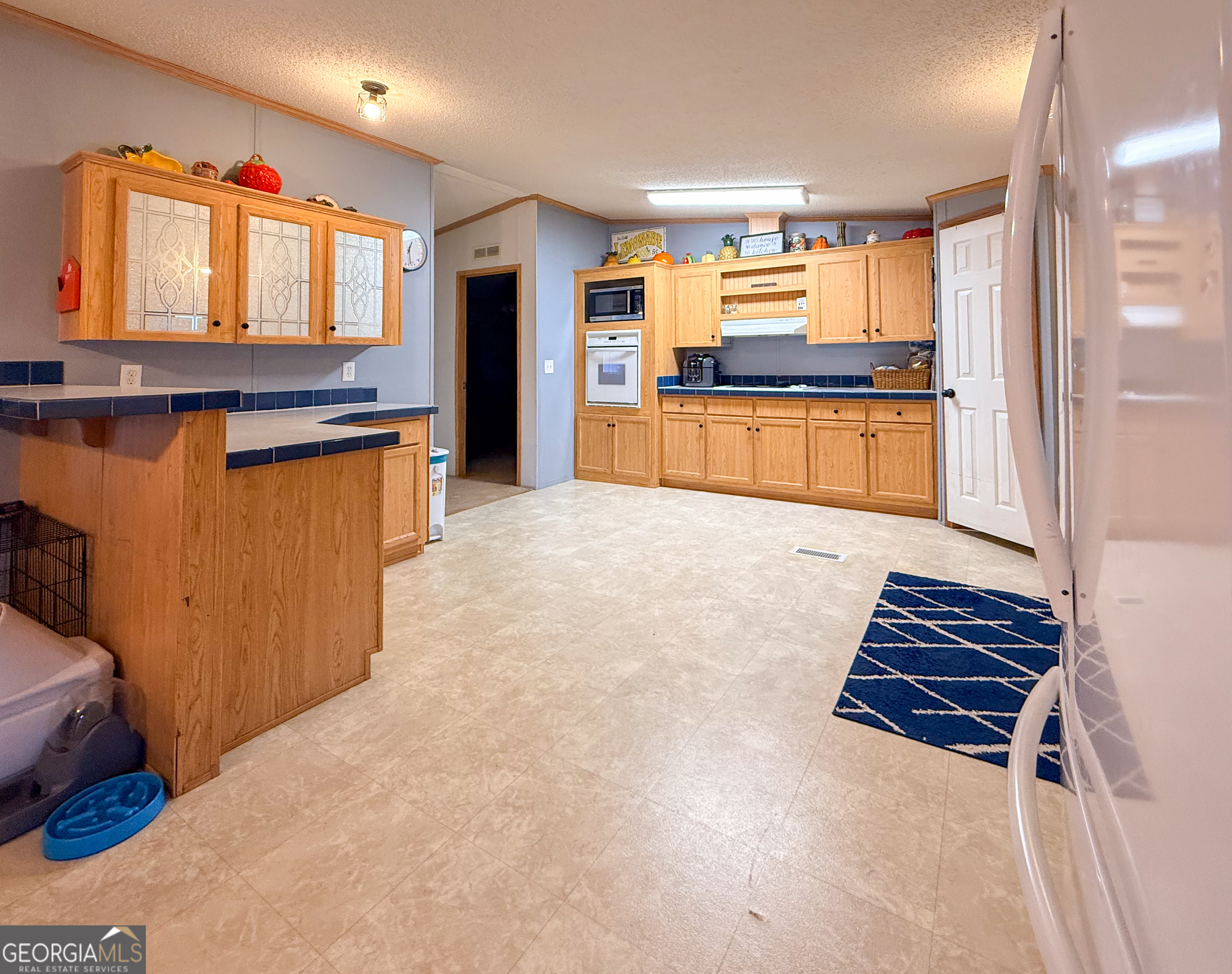 551 Hester Road Dahlonega, GA 30533 - Photo 7 of 35 a kitchen with stainless steel appliances granite countertop a refrigerator and a sink