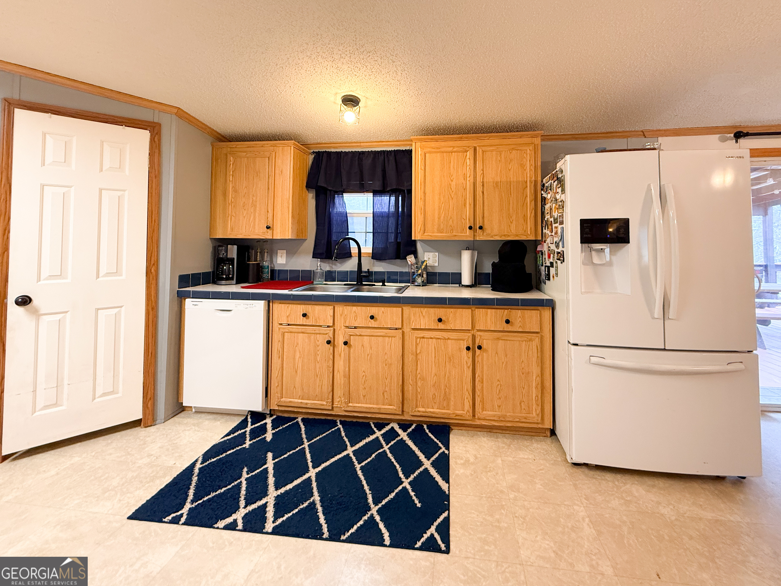 551 Hester Road Dahlonega, GA 30533 - Photo 9 of 35 a kitchen with stainless steel appliances granite countertop a stove a sink and a refrigerator