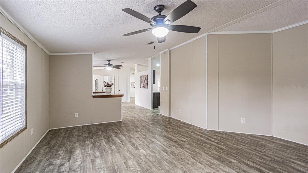 7029 Forbes Road Zephyrhills, FL 33540 - Photo 13 of 53 a view of a kitchen with a sink and a window
