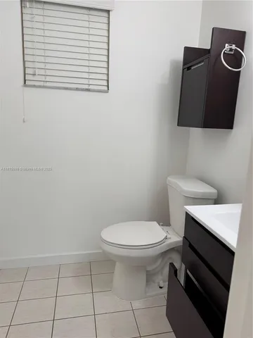 a bathroom with a toilet and a sink