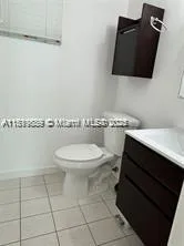 a bathroom with a toilet and a sink