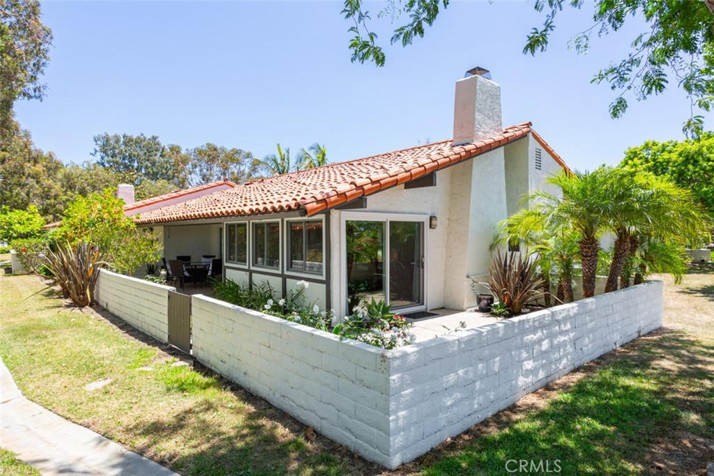 302 Esplanade Newport Beach, CA 92660 - Photo 33 of 40 View of home and wrap-around patio
