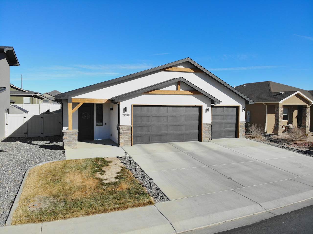 2476 Zenith Lane, Unit B Grand Junction, CO 81505 - Photo 1 of 24 a front view of a house with yard