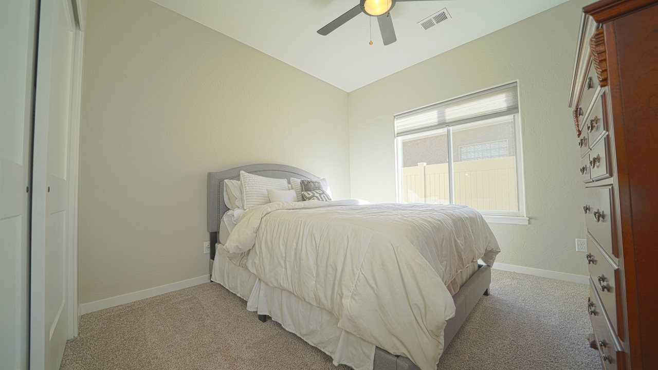 2476 Zenith Lane, Unit B Grand Junction, CO 81505 - Photo 15 of 24 a bedroom with a bed and a window
