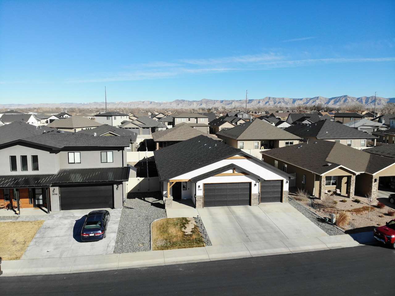 2476 Zenith Lane, Unit B Grand Junction, CO 81505 - Photo 23 of 24 an aerial view of a house with cars parked