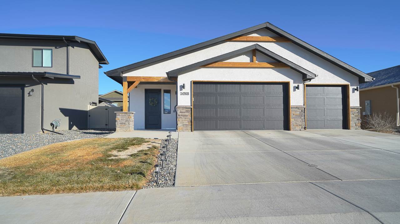 2476 Zenith Lane, Unit B Grand Junction, CO 81505 - Photo 24 of 24 a front view of a house with a yard