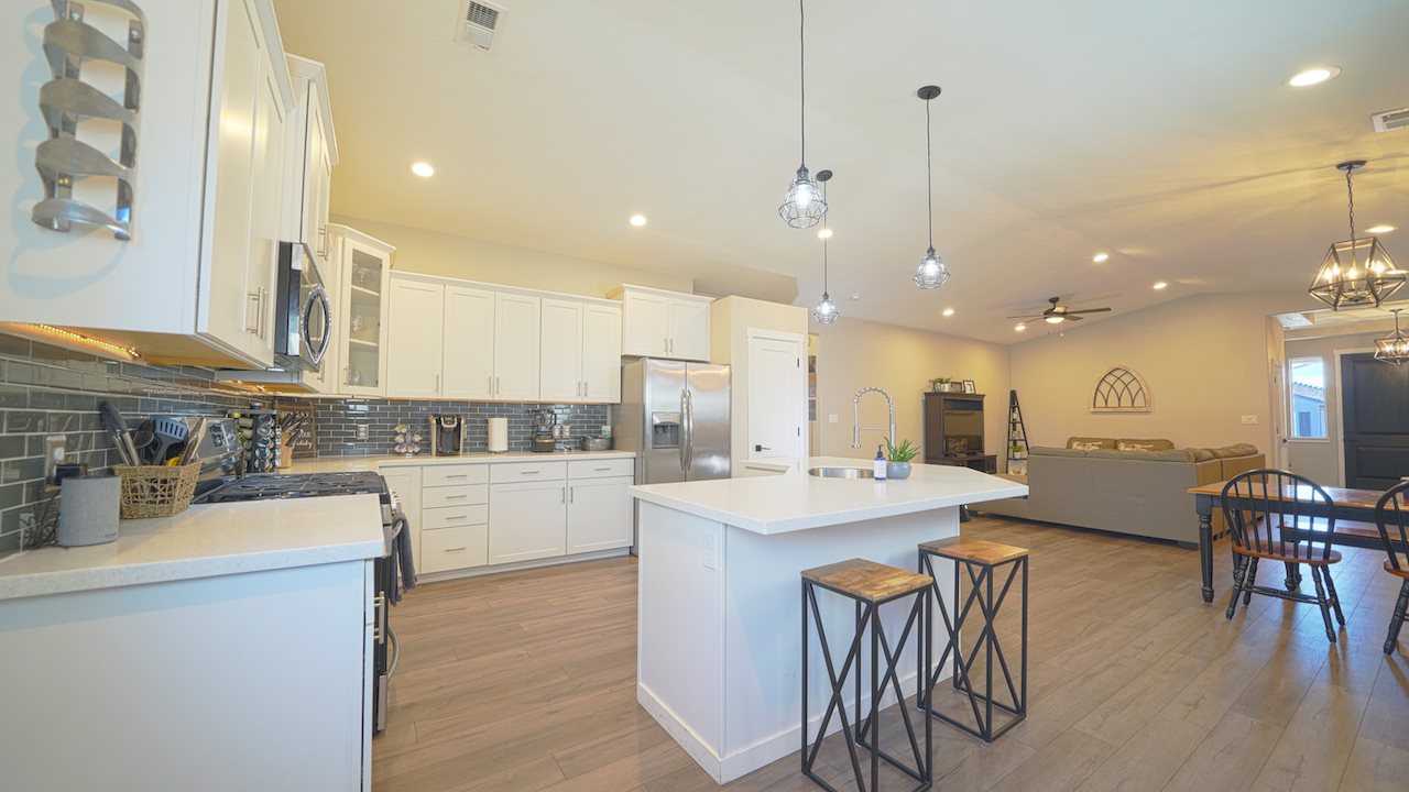 2476 Zenith Lane, Unit B Grand Junction, CO 81505 - Photo 6 of 24 a large kitchen with a table and chairs