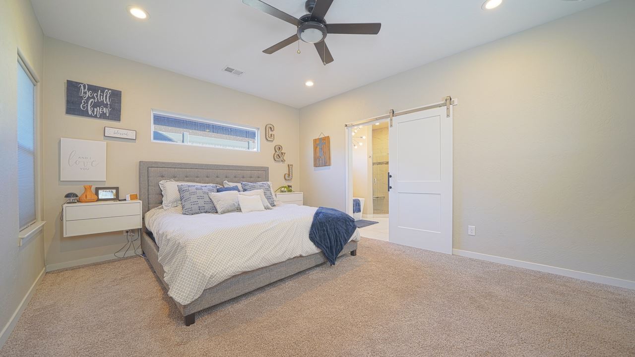 2476 Zenith Lane, Unit B Grand Junction, CO 81505 - Photo 10 of 24 a bedroom with a bed and window