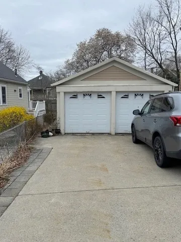 a view of a car parked in front of house