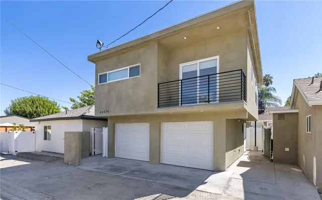a front view of a house with a garage