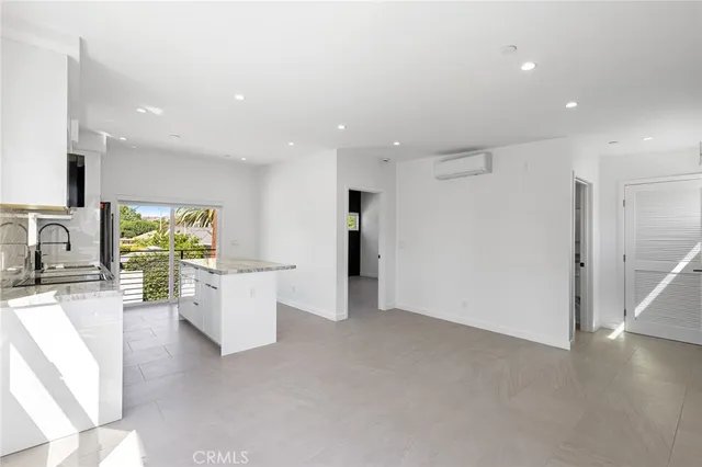 a view of living room with furniture and a flat screen tv