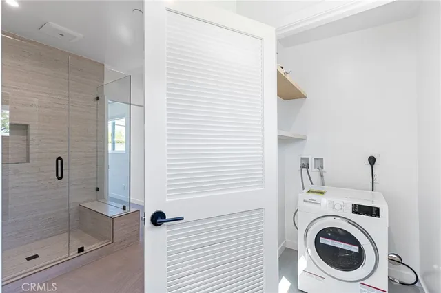 a bathroom with a sink and washing machine