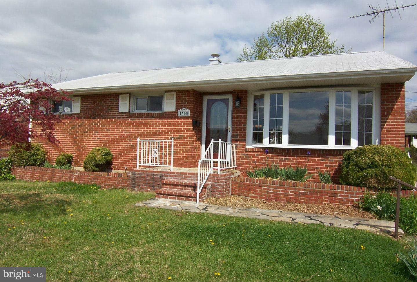 1505 Cavel Road Rosedale, MD 21237 - Photo 1 of 27 a front view of a house with a yard