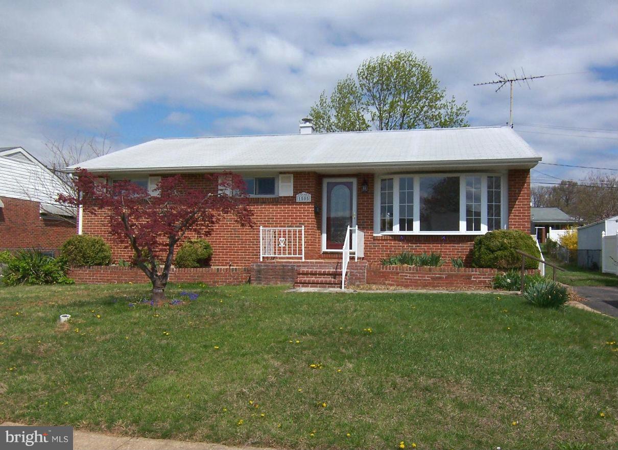 1505 Cavel Road Rosedale, MD 21237 - Photo 2 of 27 a front view of a house with garden