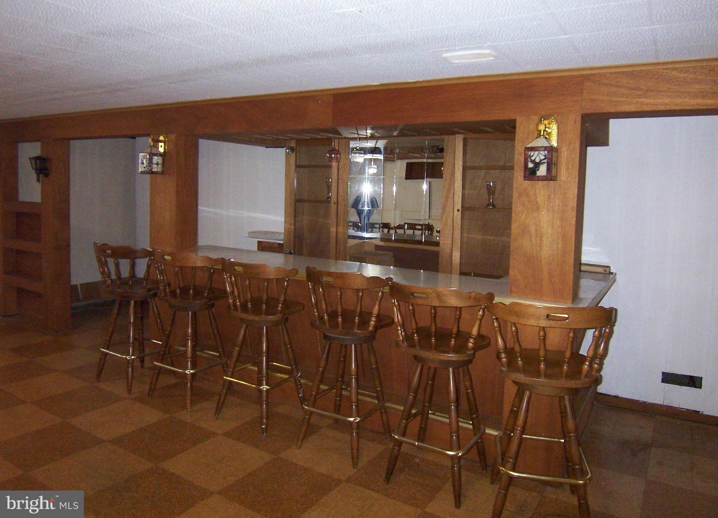 1505 Cavel Road Rosedale, MD 21237 - Photo 22 of 27 a view of a dining room with furniture and wooden floor