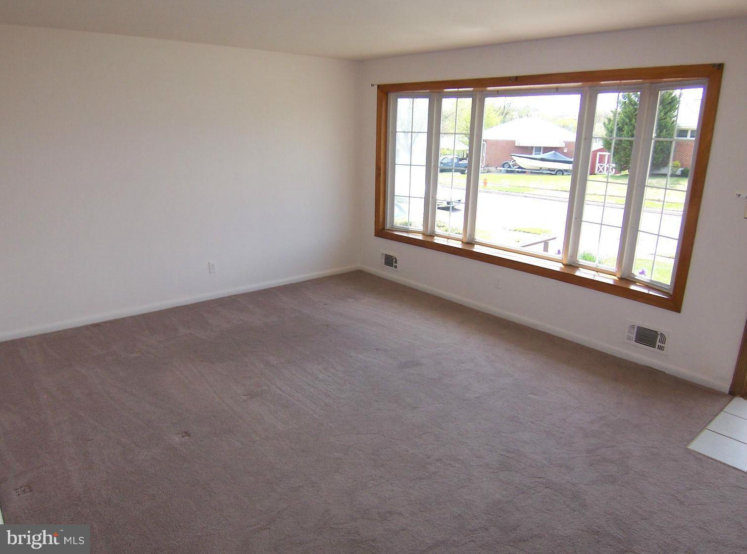 1505 Cavel Road Rosedale, MD 21237 - Photo 4 of 27 an empty room with windows