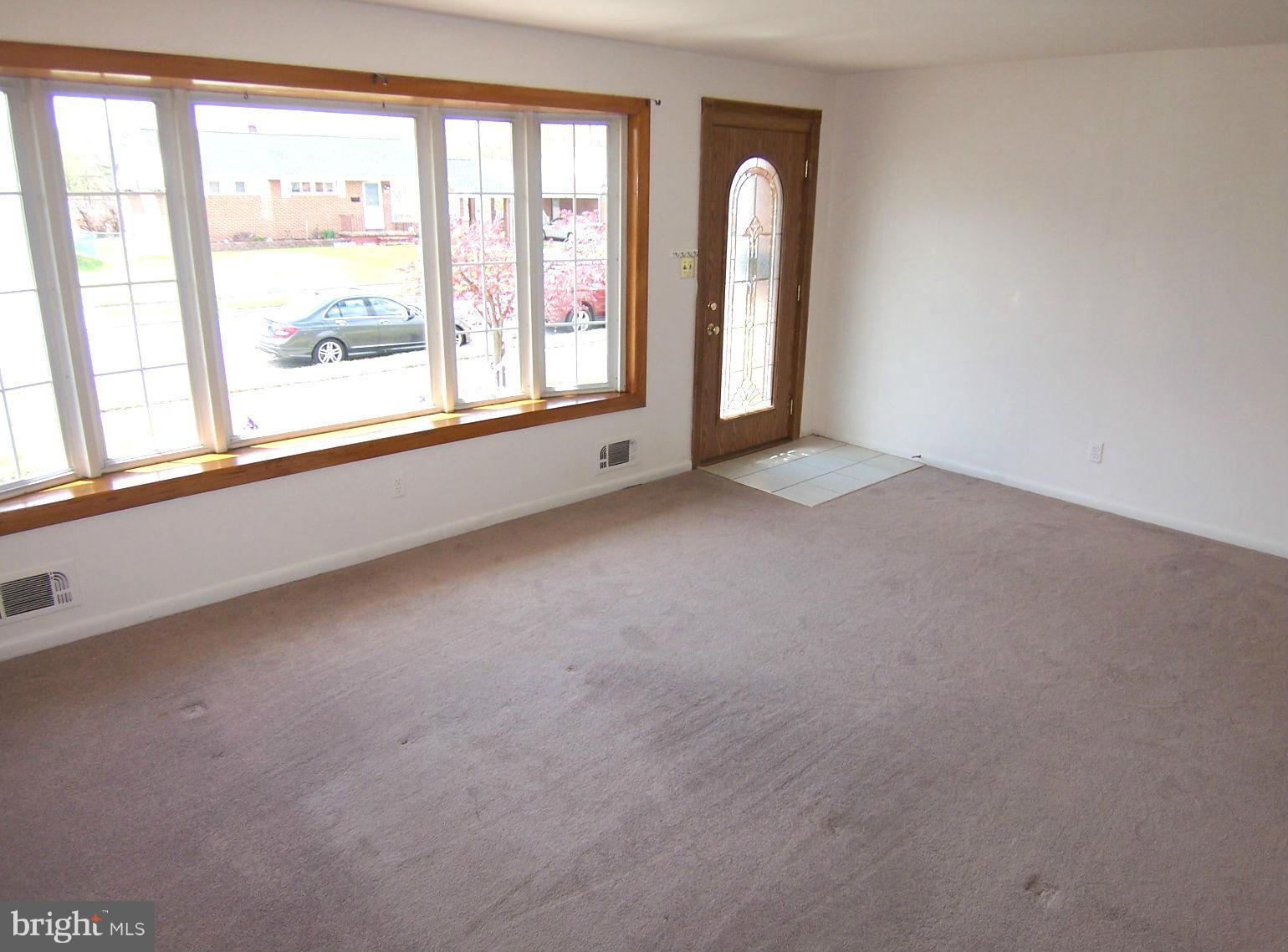 1505 Cavel Road Rosedale, MD 21237 - Photo 5 of 27 an empty room with windows