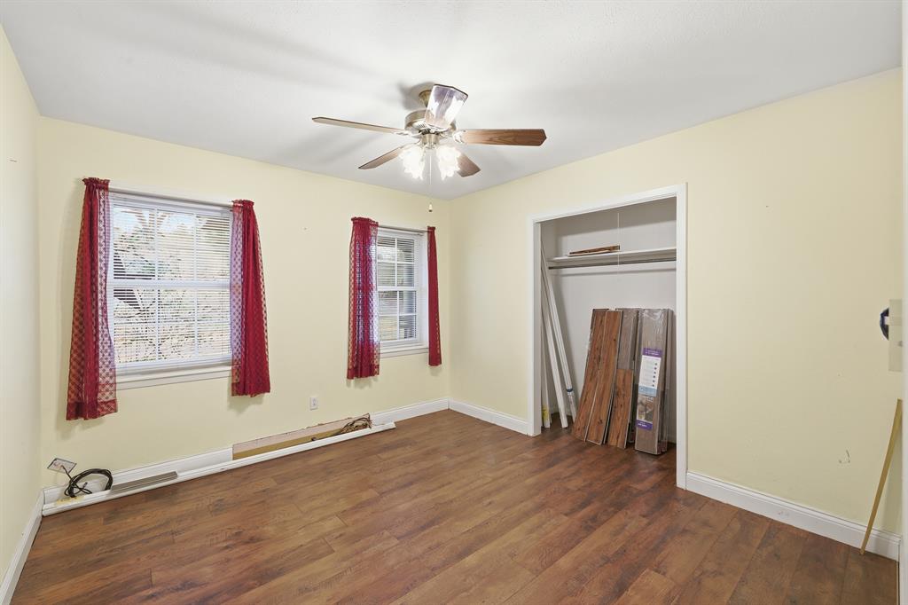 240 Fm 3421 Daingerfield, TX 75638 - Photo 13 of 27 a view of an empty room with window and wooden floor