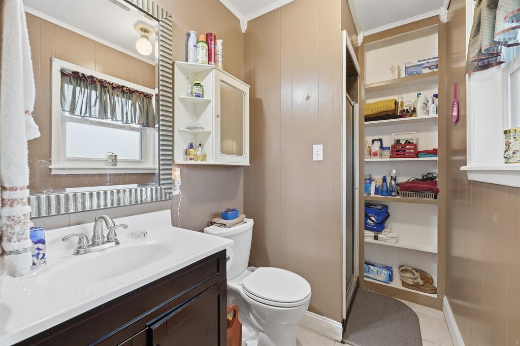 240 Fm 3421 Daingerfield, TX 75638 - Photo 17 of 27 a bathroom with a sink vanity mirror and toilet