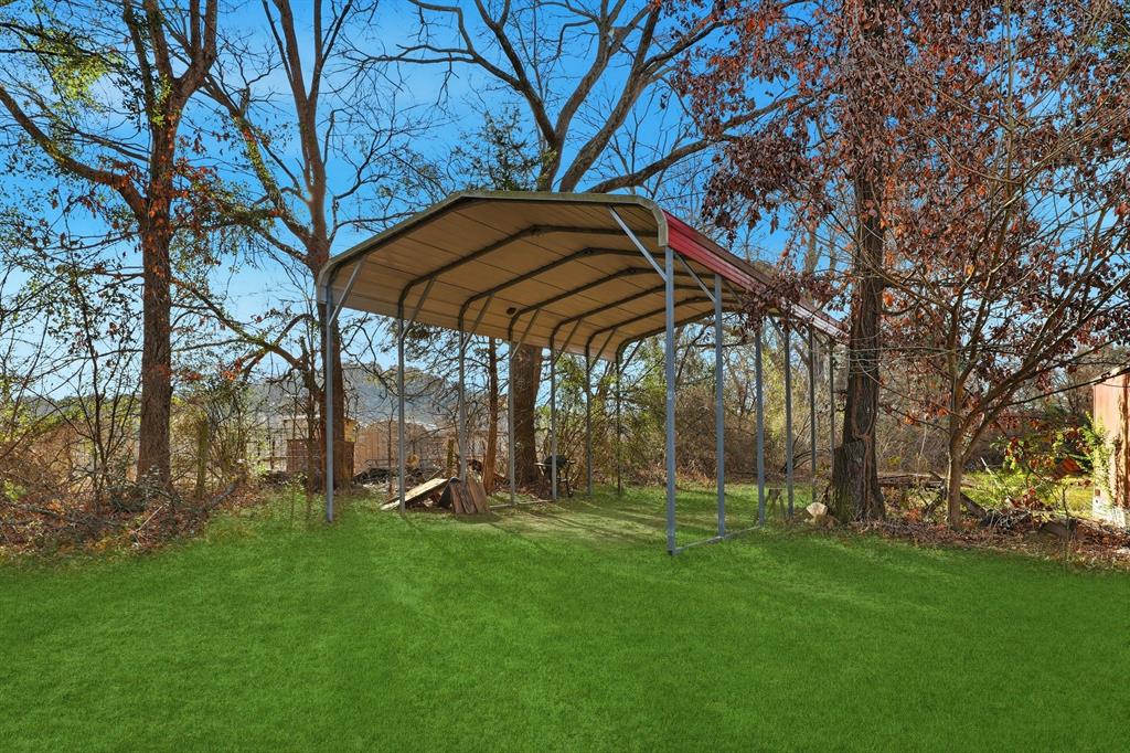 240 Fm 3421 Daingerfield, TX 75638 - Photo 22 of 27 a view of a backyard with a garden and trees