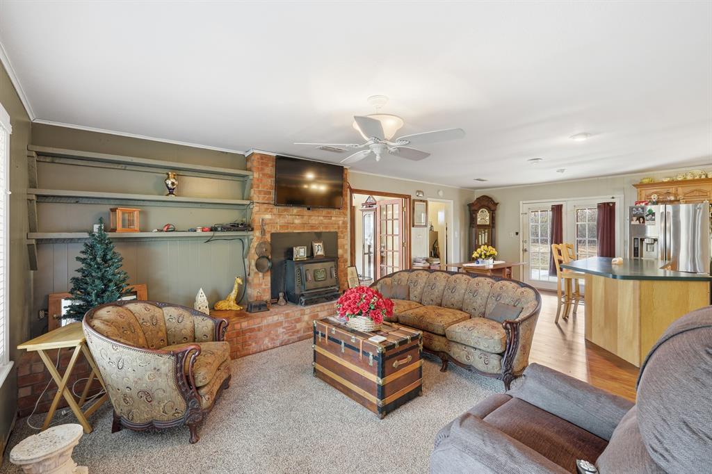 240 Fm 3421 Daingerfield, TX 75638 - Photo 3 of 27 a living room with furniture and a fireplace